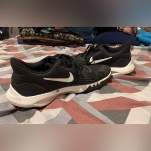 Black Nike athletic shoes.